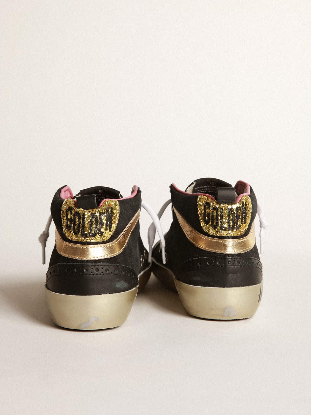 Golden Goose - Black Mid-Star sneakers with gold-coloured inserts and glitter in 