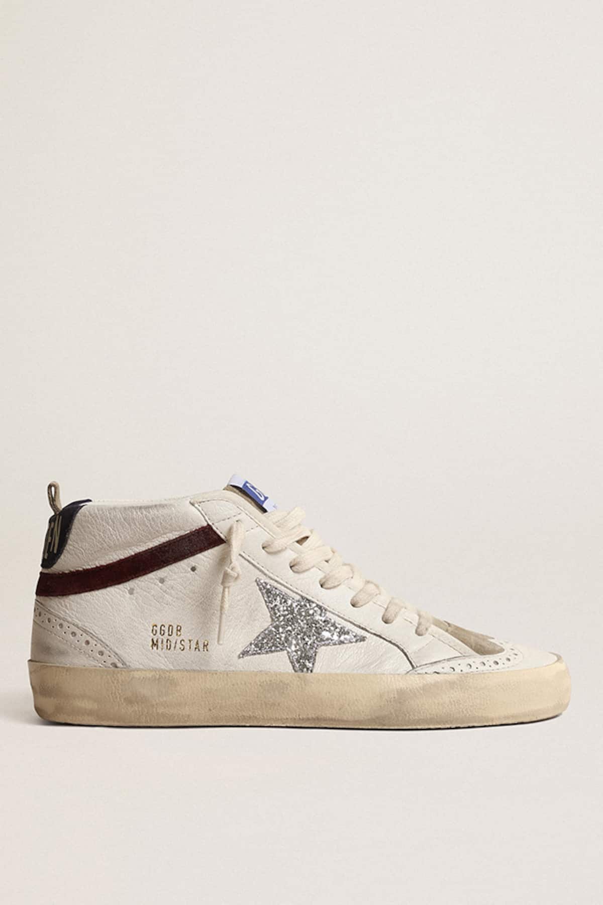 Golden Goose - Mid Star de mujer con estrella con purpurina plateada y refuerzo del talón de ante azul oscuro in 