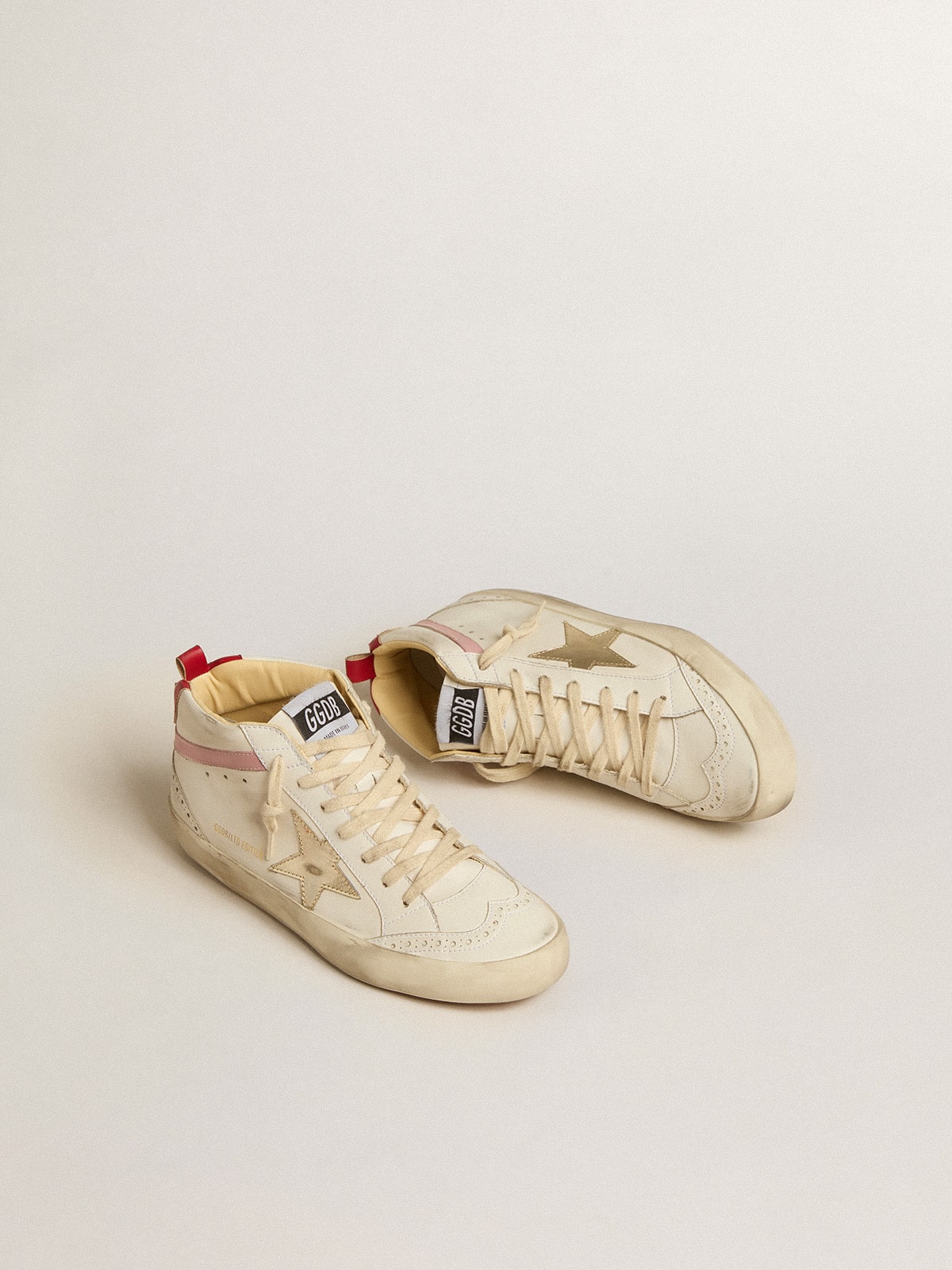 Golden Goose - Bio-based Mid Star LTD with gold leather star and pink flash in 