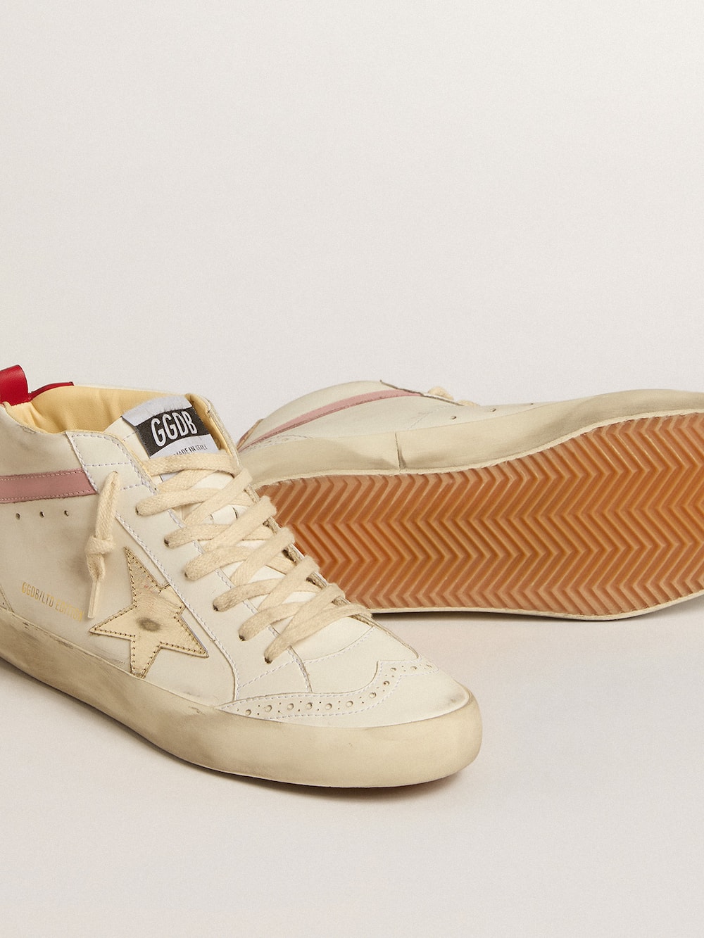 Golden Goose - Bio-based Mid Star LTD with gold leather star and pink flash in 