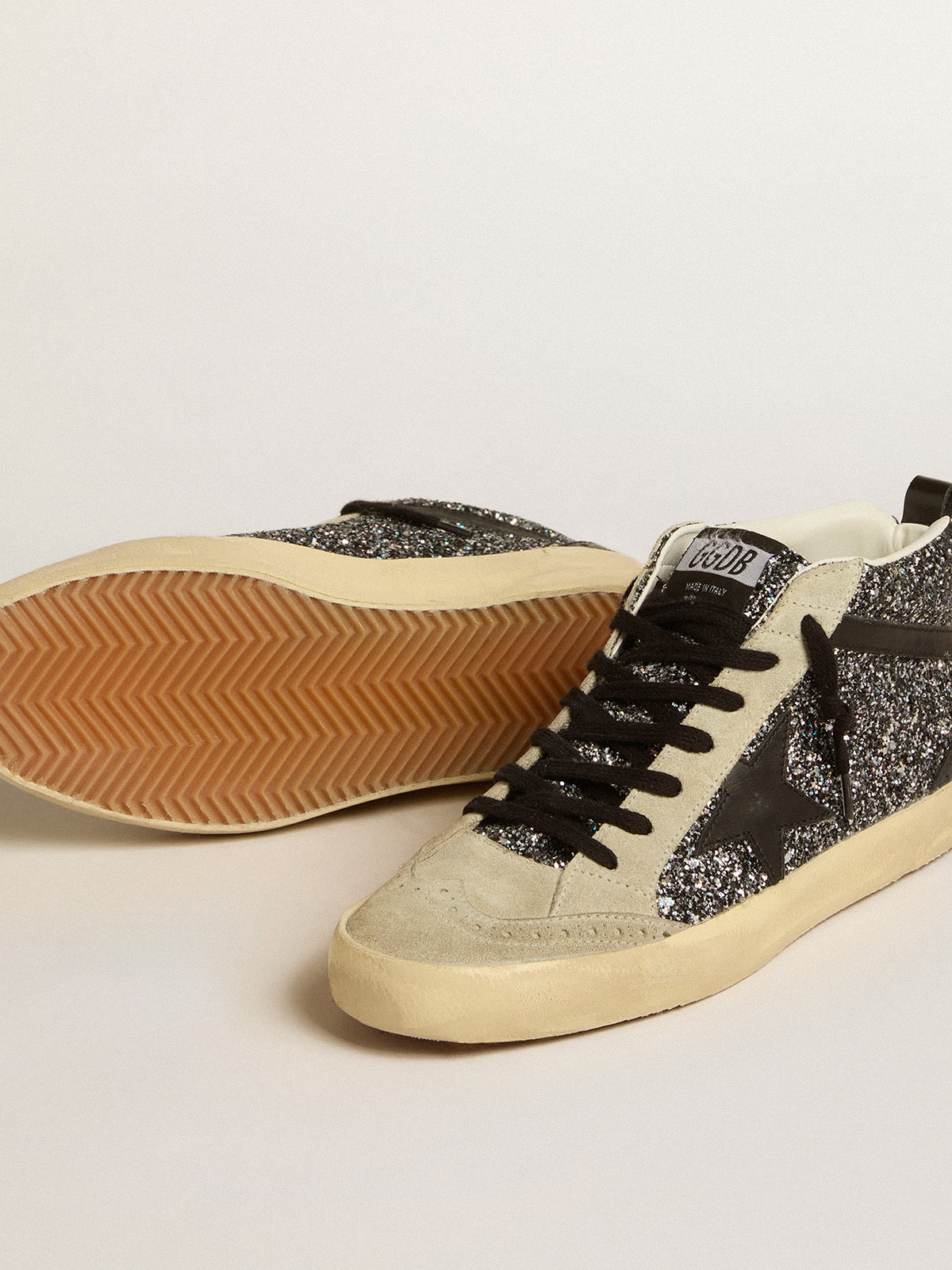 Mid Star LTD in black glitter with black leather star and flash Golden Goose