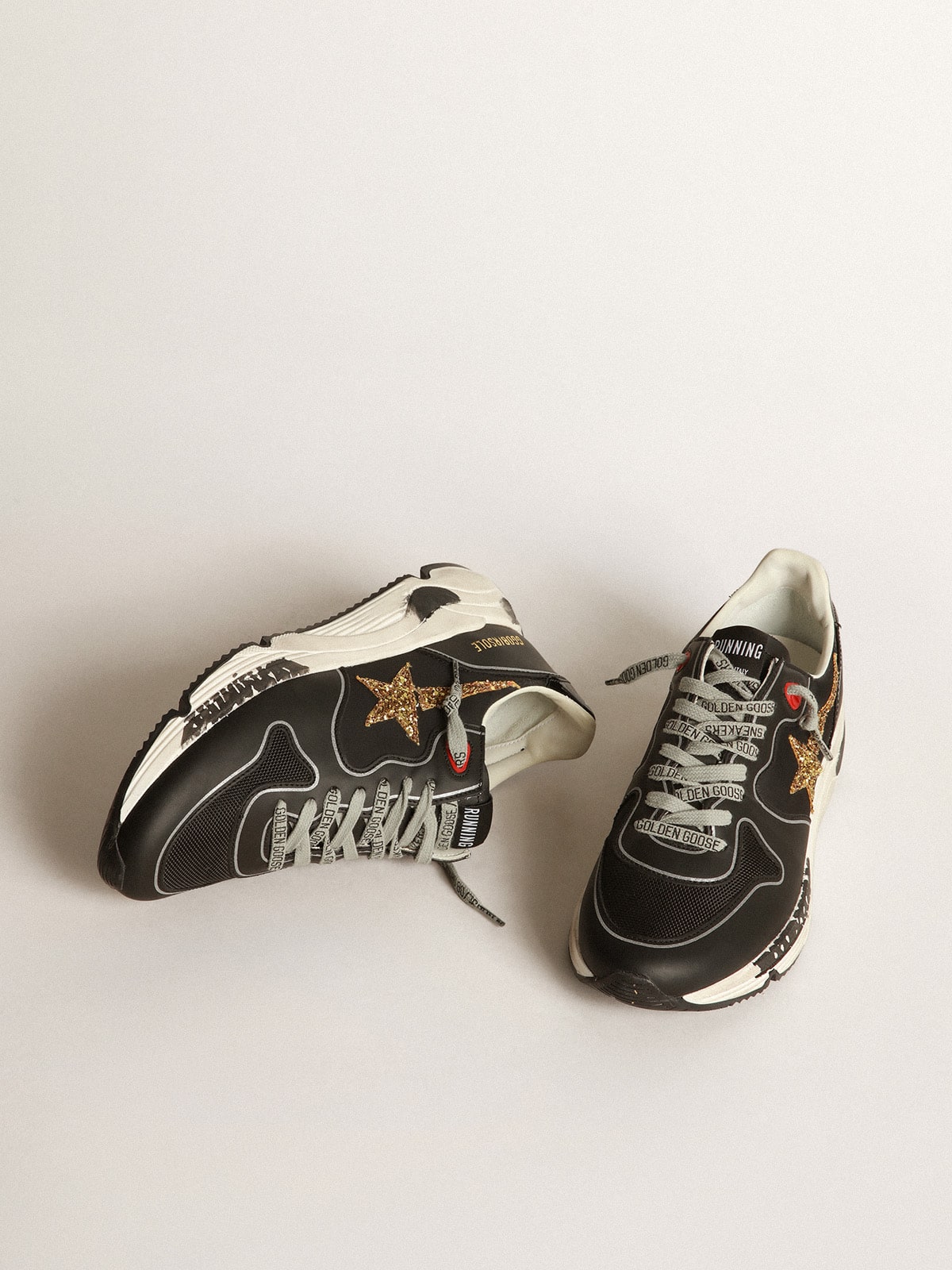 Golden Goose - Black Running Sole sneakers with glittery gold star in 