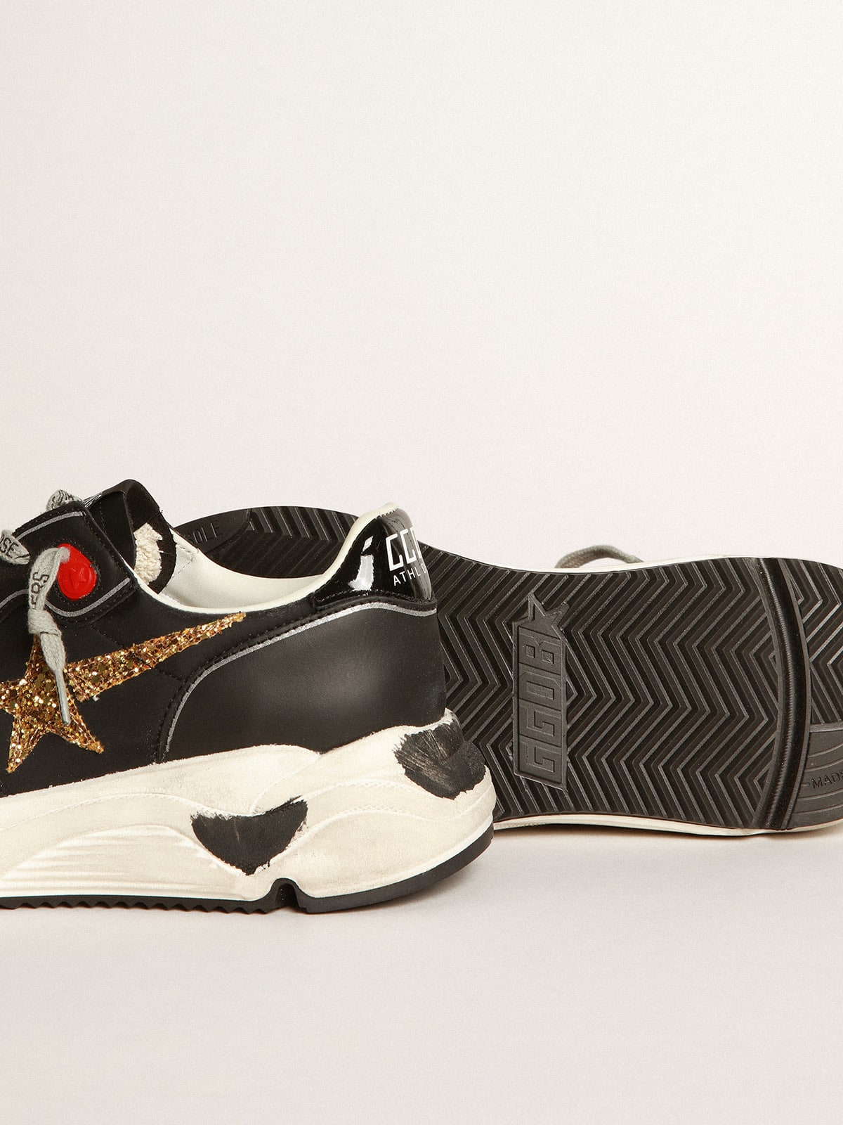 Golden Goose - Black Running Sole sneakers with glittery gold star in 