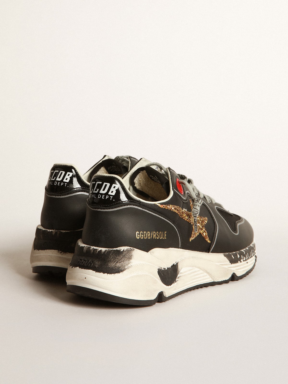 Golden Goose - Black Running Sole sneakers with glittery gold star in 