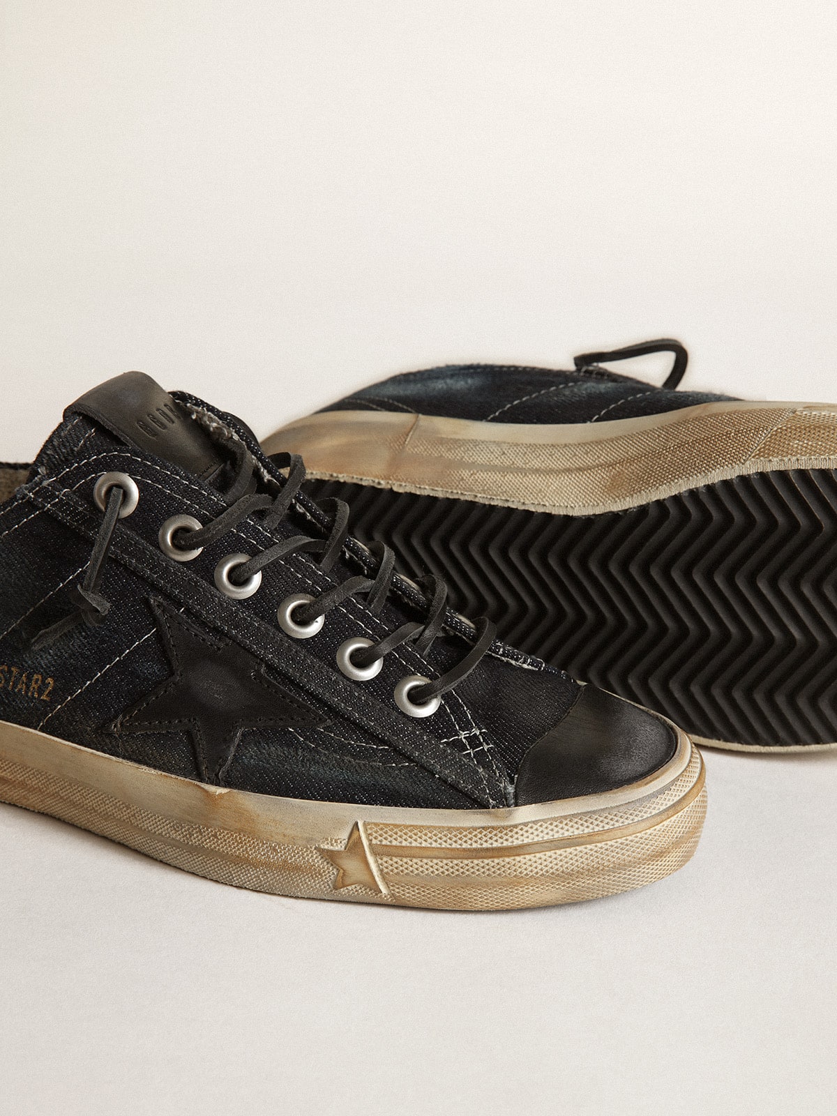 V-Star in midnight-blue denim with black leather star and V-Star in midnight-blue denim with black leather star and