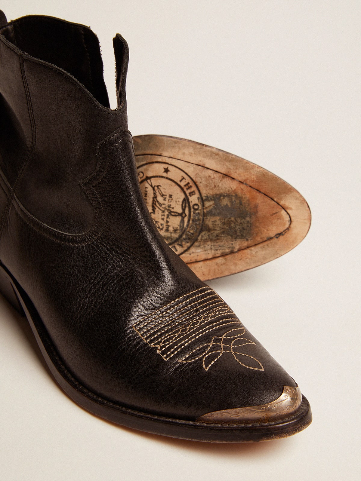 Young ankle boots in black leather with sand colored embroidery Golden Goose