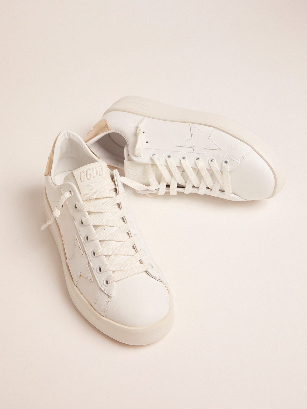 Women s Purestar sneakers with gold coloured heel tab Golden Goose