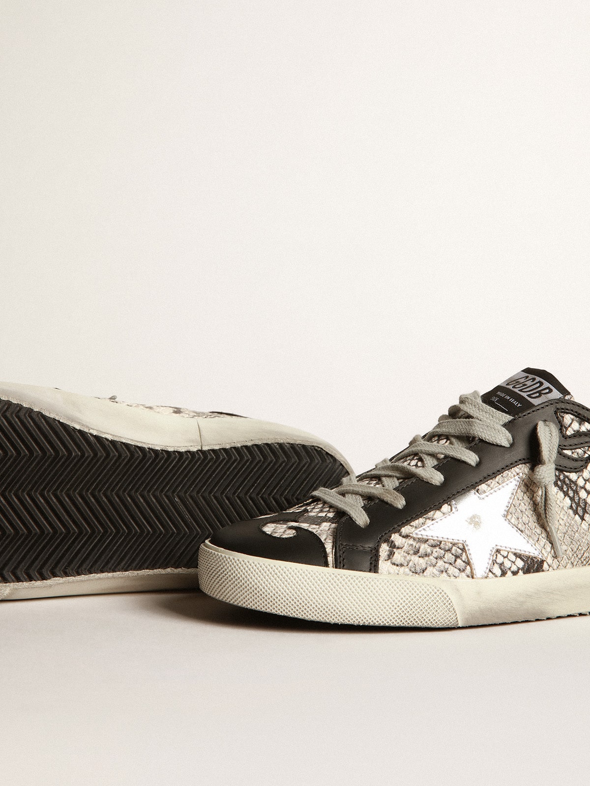 Golden Goose - Sneakers Super-Star mit Pythonmusterung und Silberstern in 