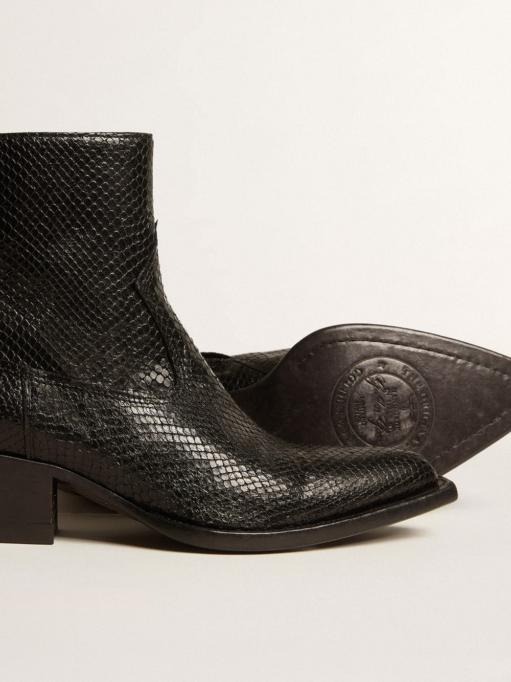 Golden Goose - Low Debbie boots in black snake-print leather in 