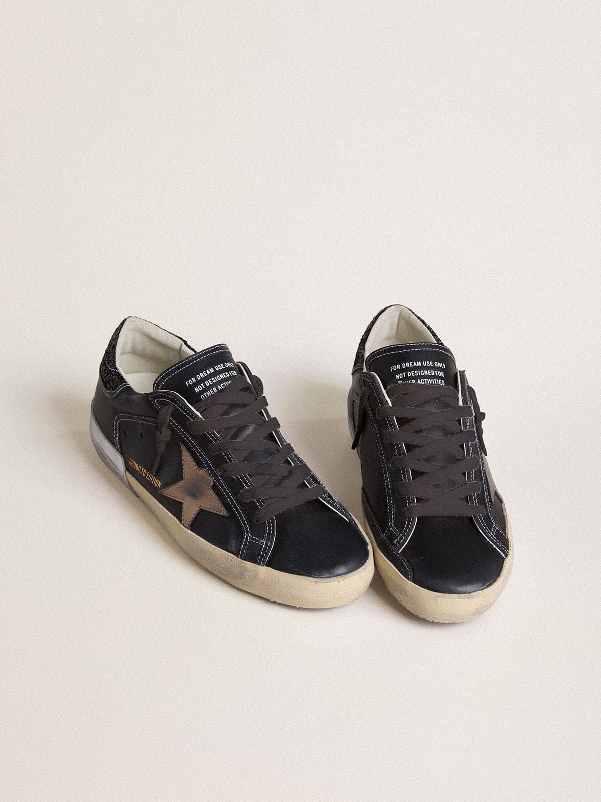 Golden Goose - Women's Super-Star LTD in black leather with gold leather star and black glitter heel tab in 