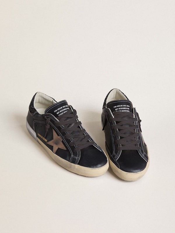 Golden Goose - Women's Super-Star LTD in black leather with gold leather star and black glitter heel tab in 