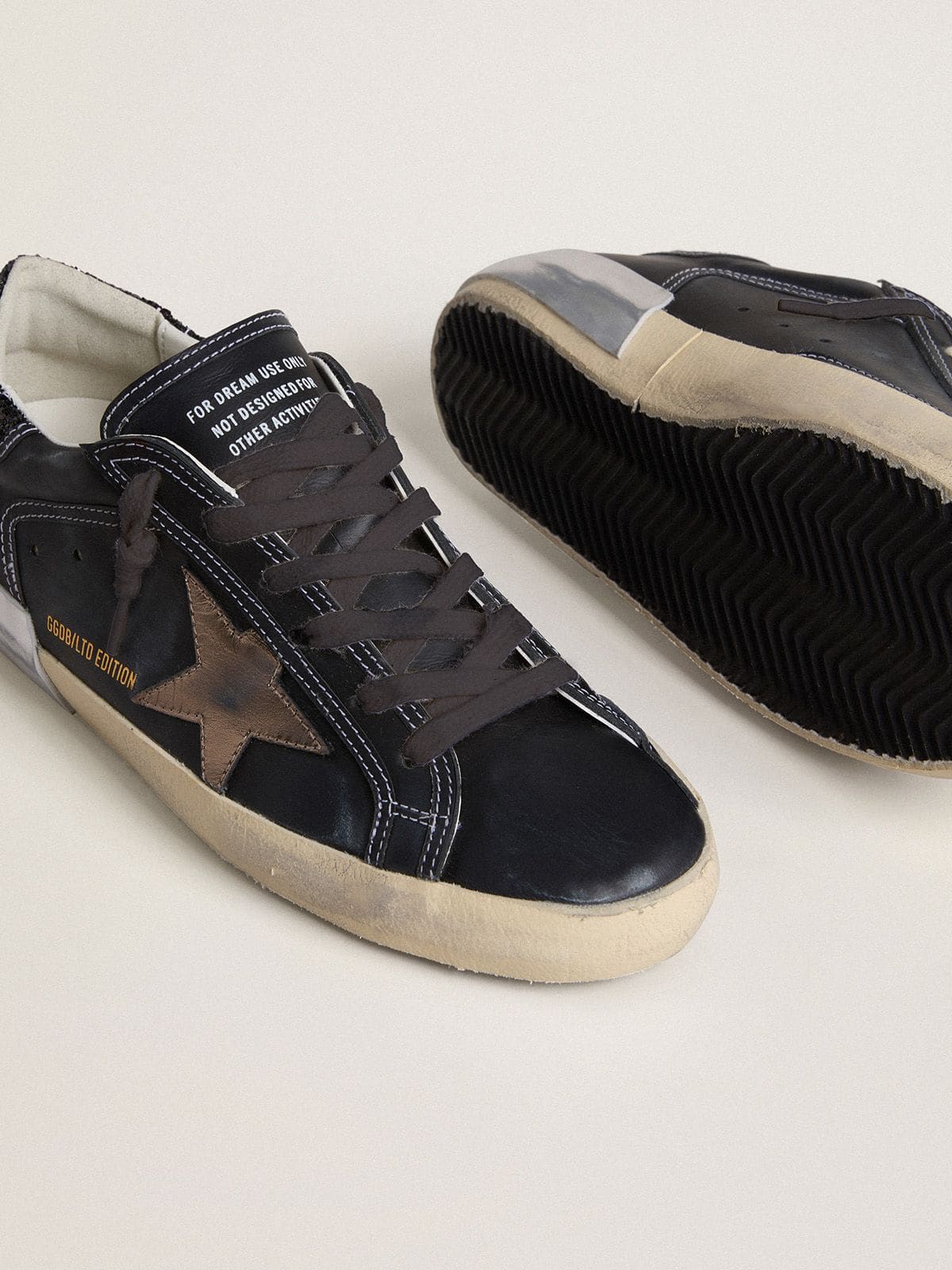 Golden Goose - Women's Super-Star LTD in black leather with gold leather star and black glitter heel tab in 