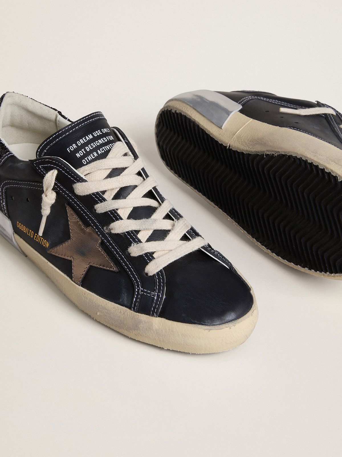 Golden Goose - Women's Super-Star LTD in black leather with gold leather star and black glitter heel tab in