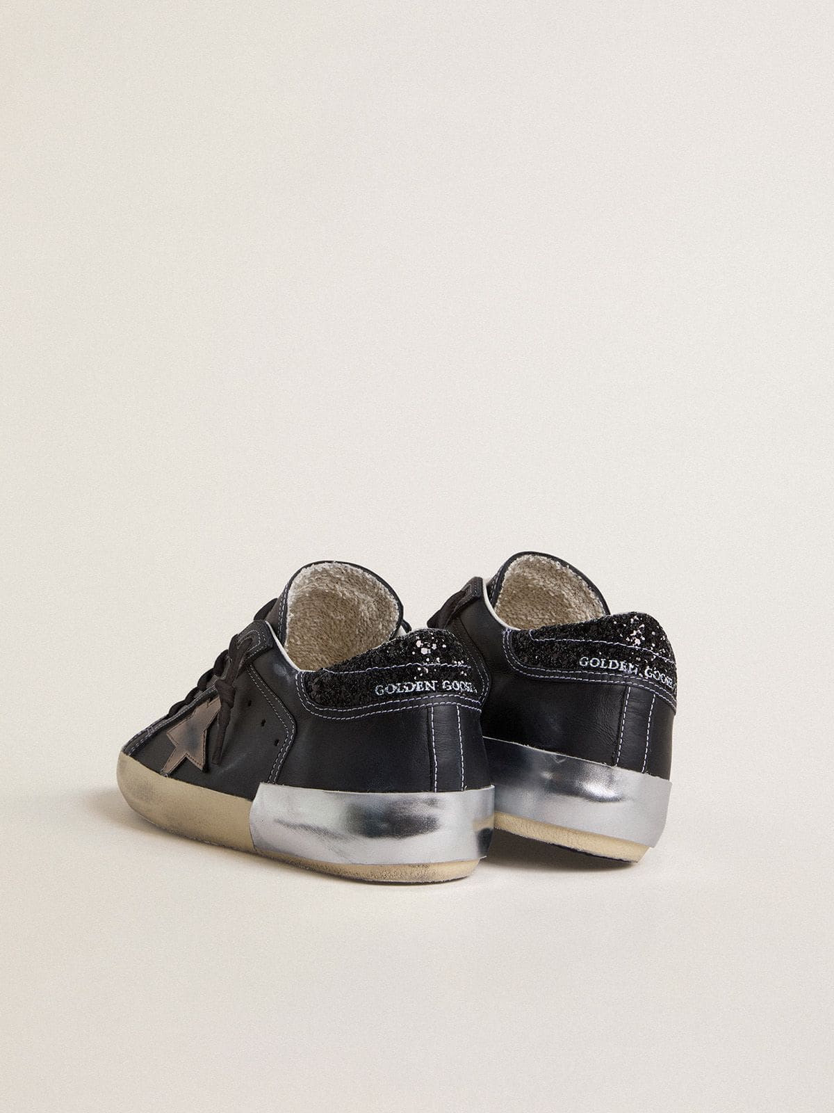 Golden Goose - Women's Super-Star LTD in black leather with gold leather star and black glitter heel tab in 