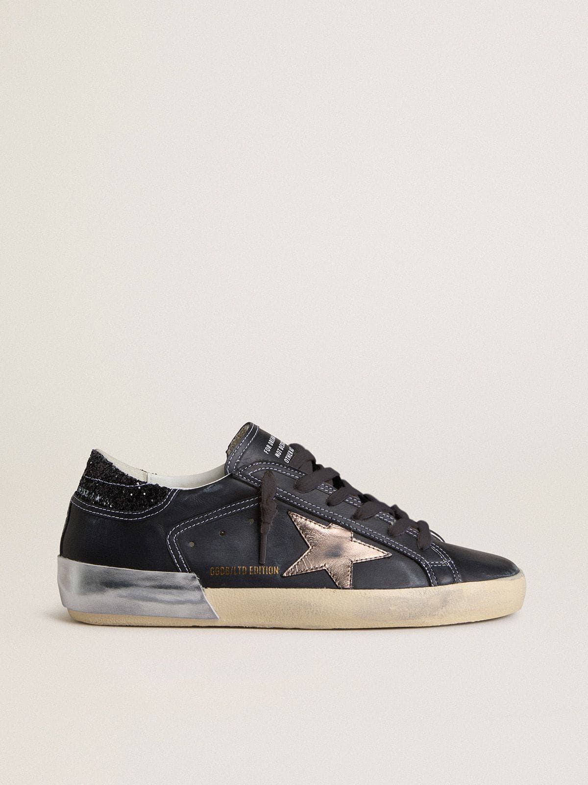 Golden Goose - Women's Super-Star LTD in black leather with gold leather star and black glitter heel tab in 