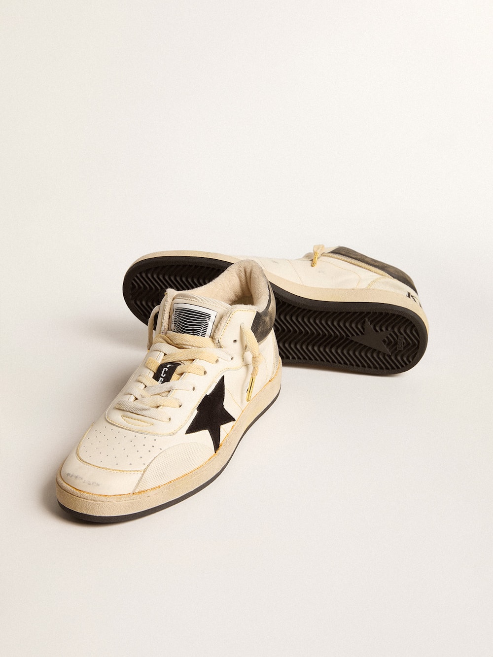 Golden Goose - Women’s Ball Star Pro Mid in aged white leather with black star in 