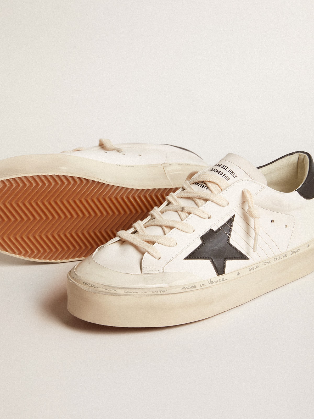 Golden Goose - Woman's white bio-based Hi Star LTD with black bio-based star and heel tab in 