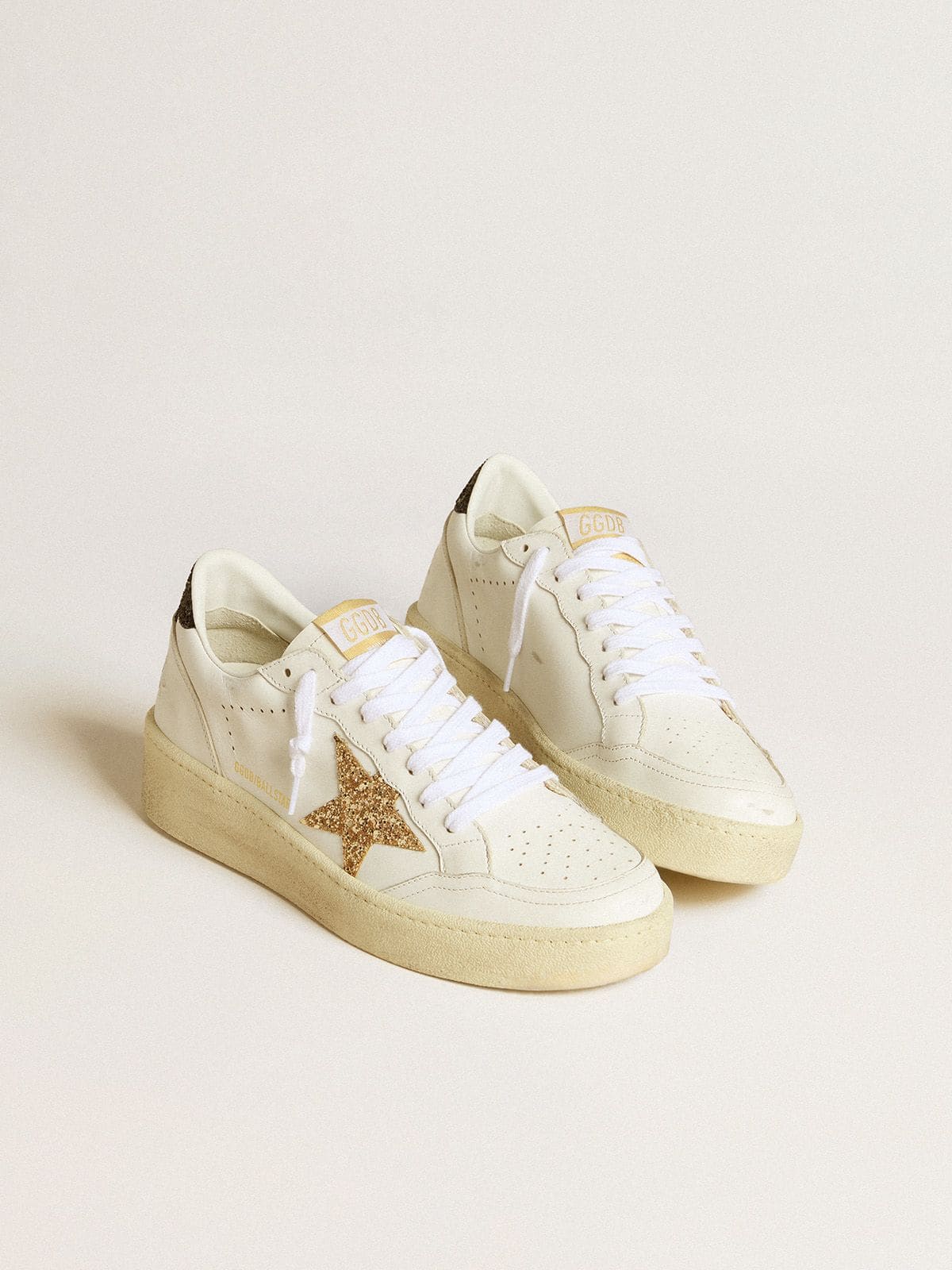 Golden Goose - Women’s Ball Star in white leather with gold glitter star and black glitter heel tab in 