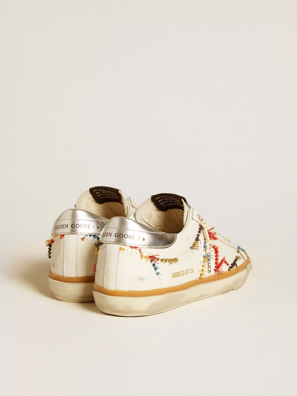 Golden Goose - Women’s Super-Star LTD with perforated star and metallic leather heel tab in 