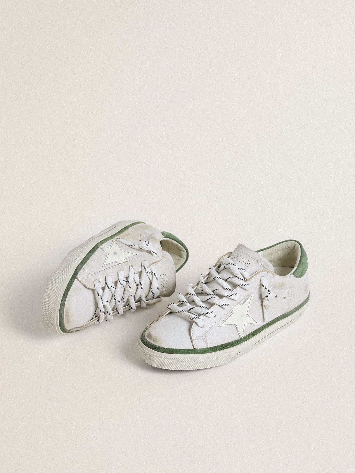 Super-Star LTD with white leather star and green suede heel tab