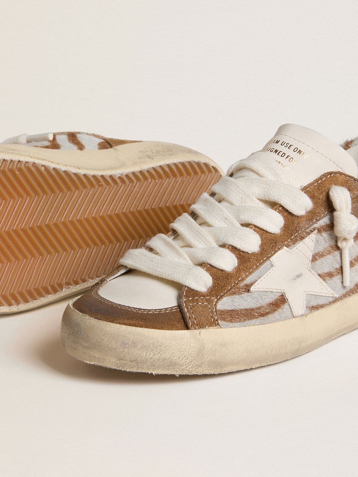 Golden Goose - Women's Super-Star in zebra-print pony skin with leather star and brown suede inserts in 