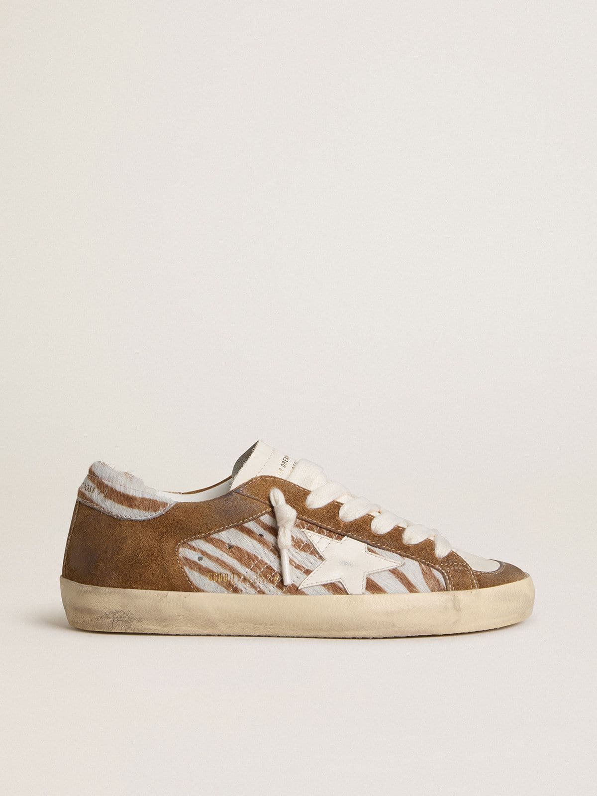 Golden Goose - Women's Super-Star in zebra-print pony skin with leather star and brown suede inserts in 