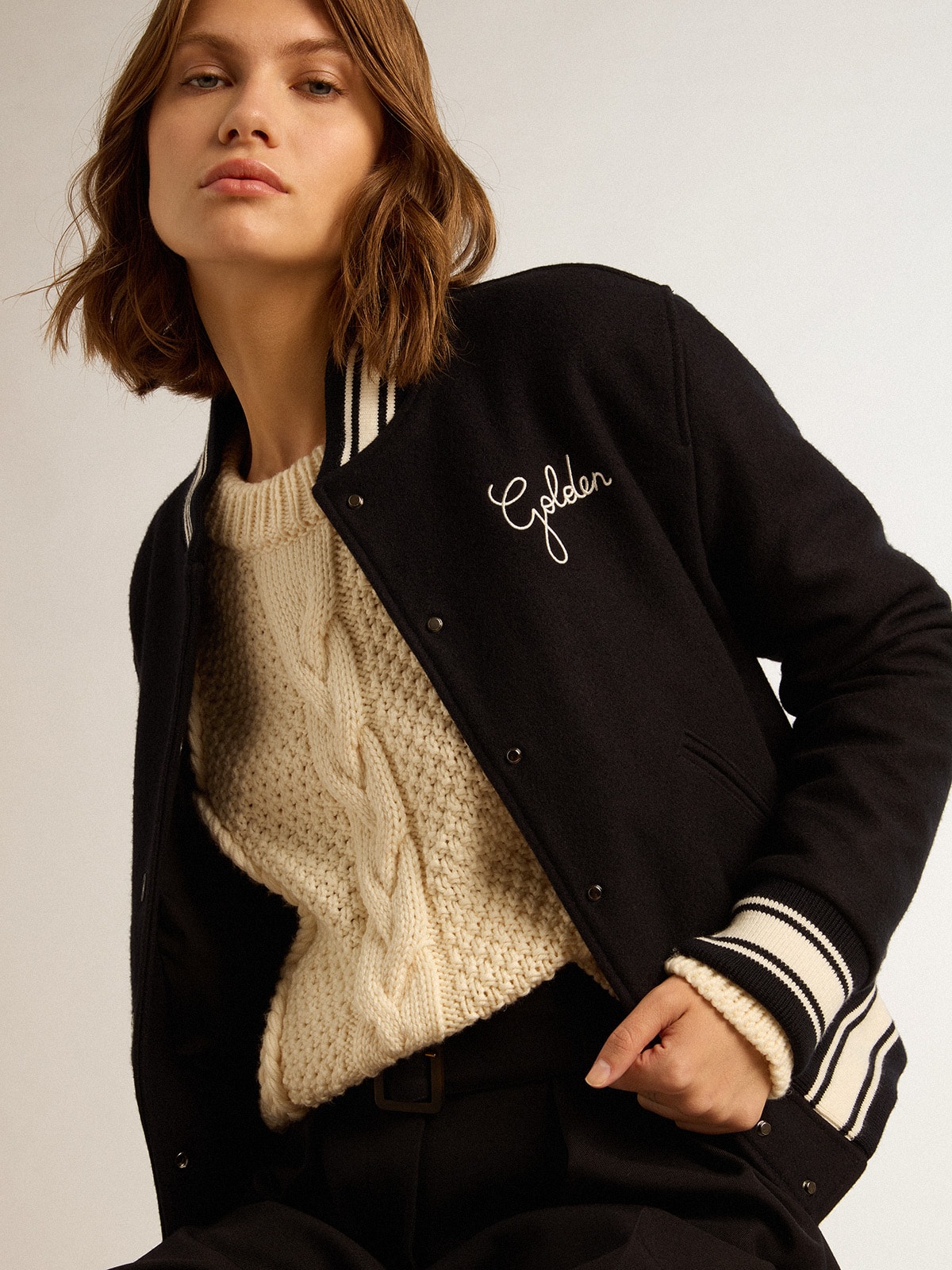 Women's bomber jacket in dark blue wool with white details ...