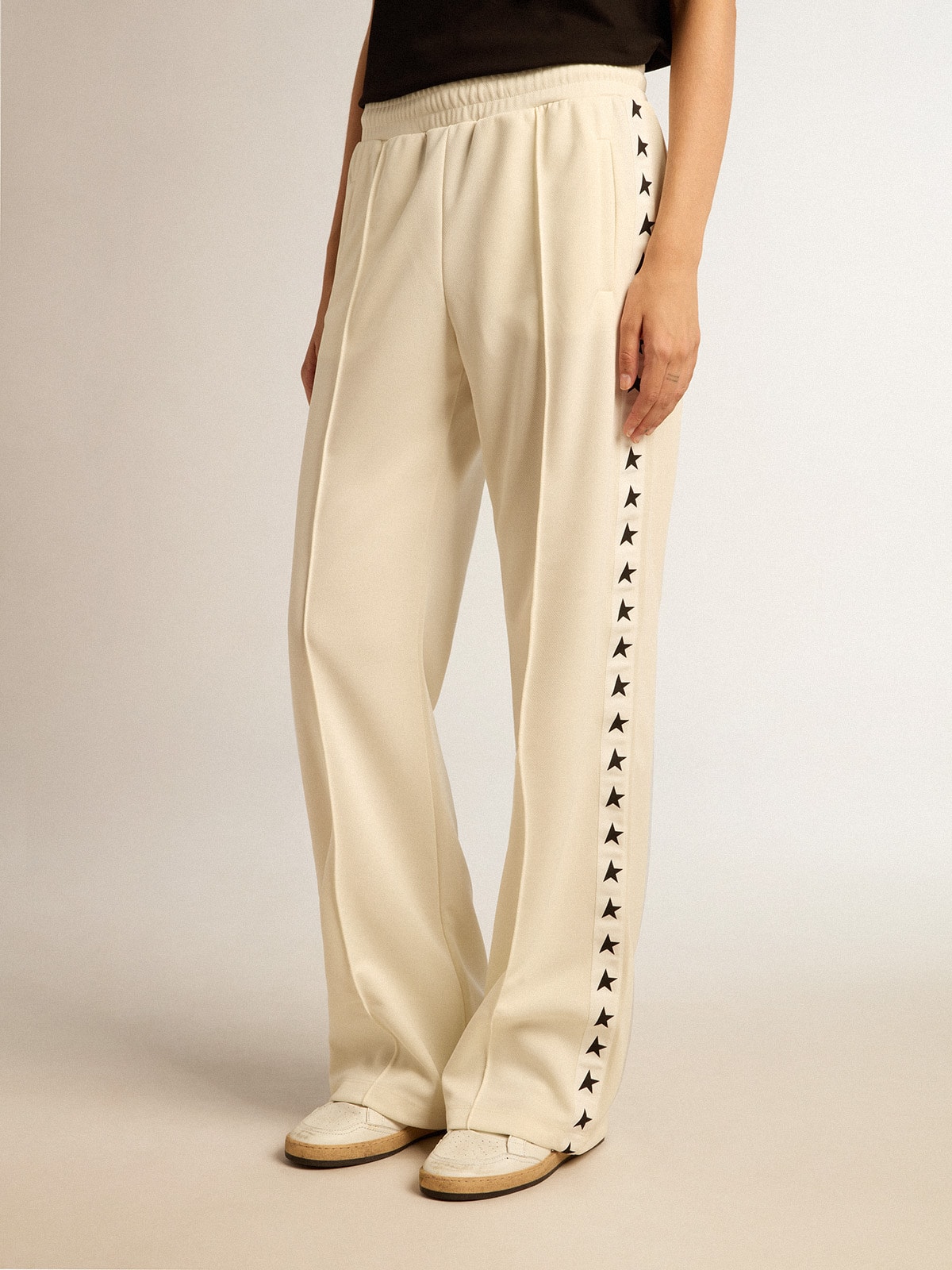 Women s white joggers with stars on the sides Golden Goose