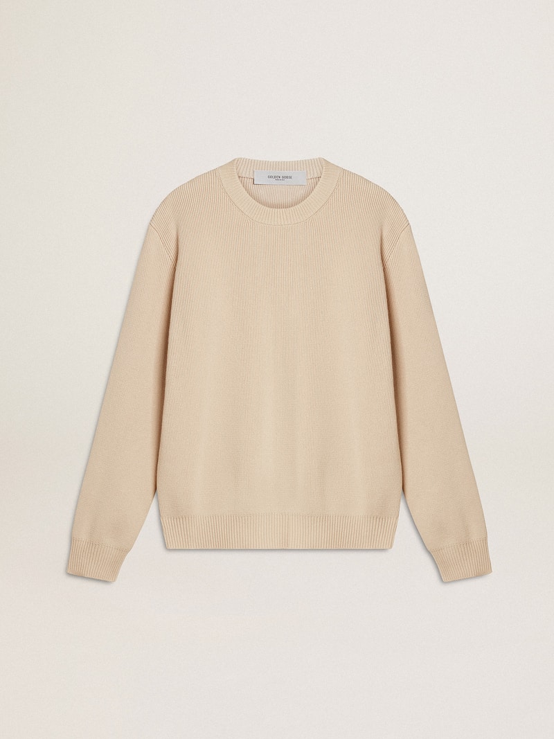 Women's beige sweater with 'Golden' lettering on the back