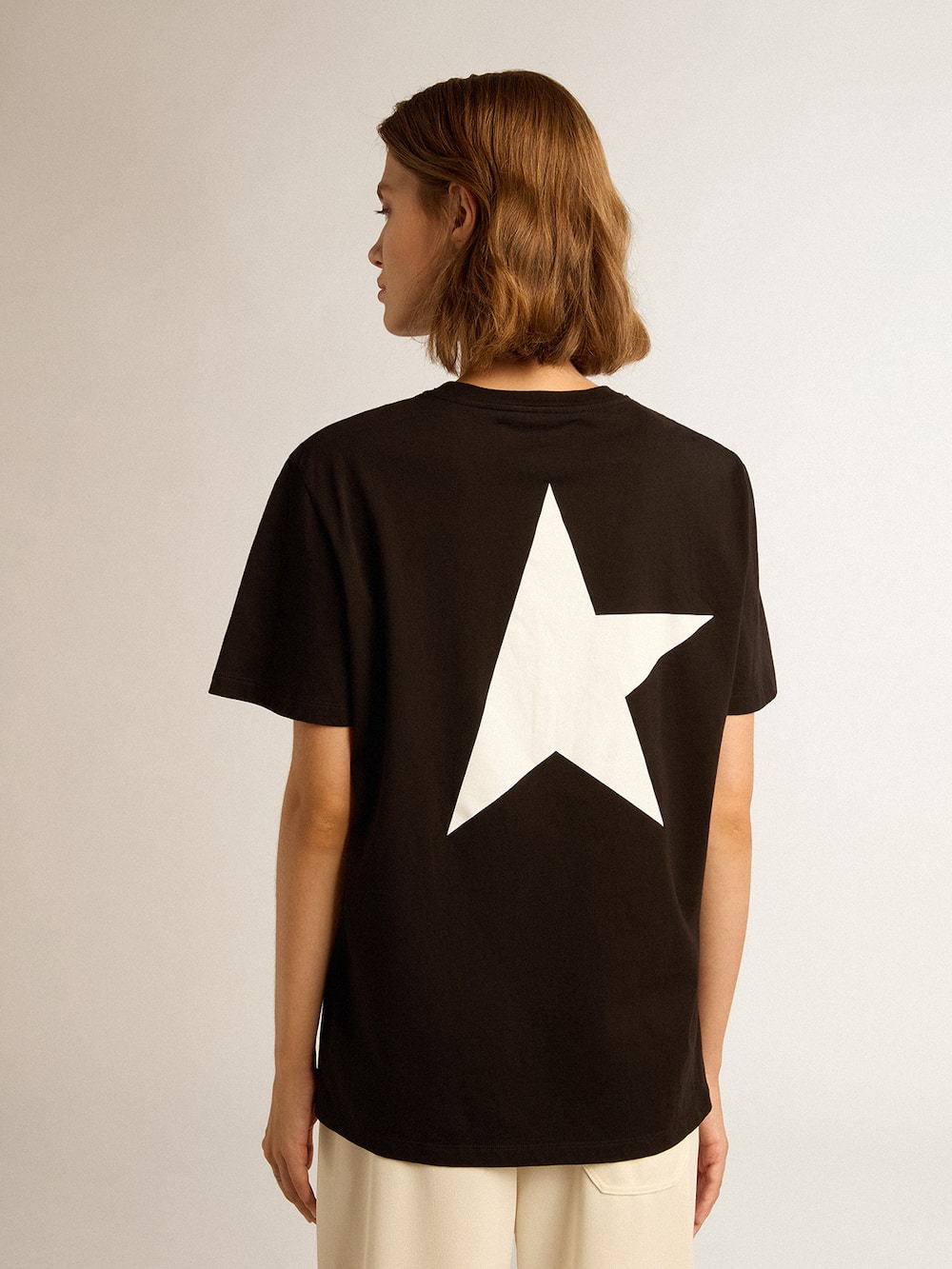 Golden Goose - Camiseta preta Coleção Star com logo e estrela brancos em contraste in 