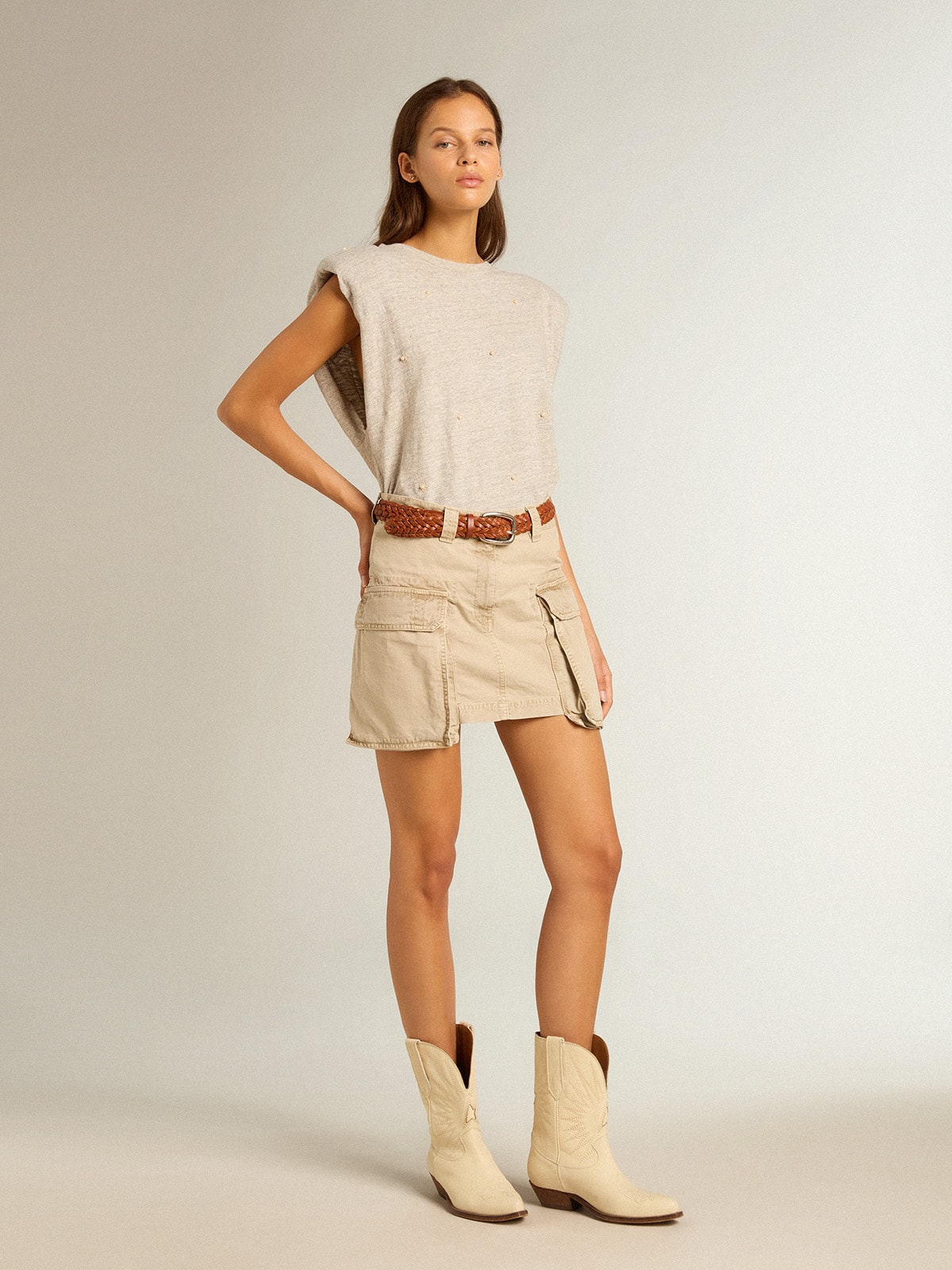 Aged white sleeveless T-shirt with padded shoulder and pearls