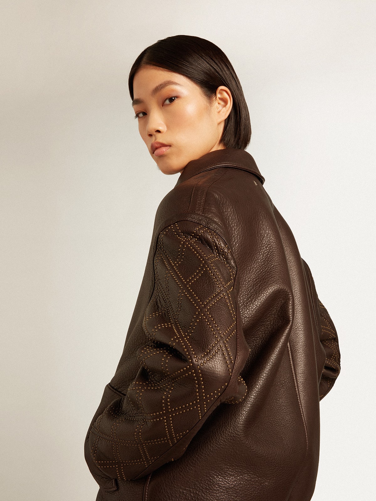 Brown nappa leather jacket with studded sleeves