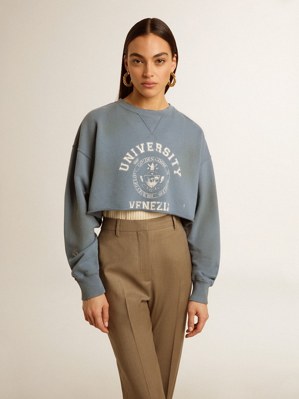 Cropped sweatshirt in baby blue with distressed finish