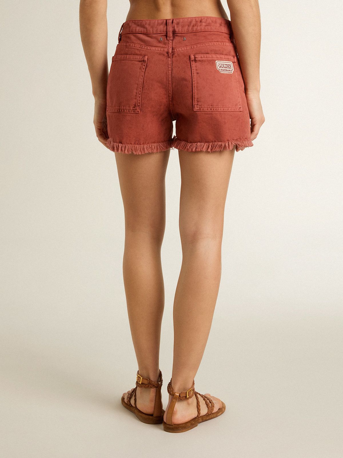 Women's shorts in brick-red denim with Golden Mediterraneo