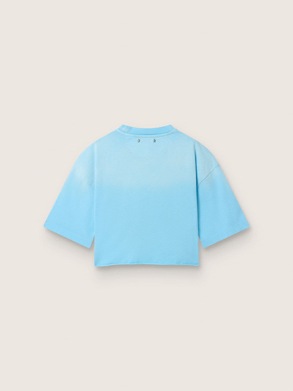 Camiseta cropped de mujer en tejido jersey de algod&oacute;n celeste con estampado gr&aacute;fico