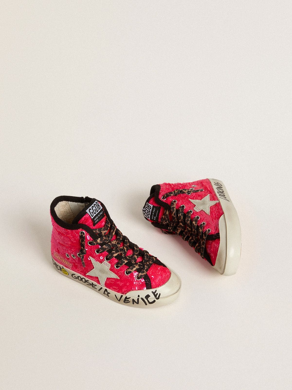 Young Francy in sequins with ice-gray suede star and animal-print laces